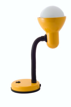 Yellow luminescent desk lamp on white backgroundの写真素材