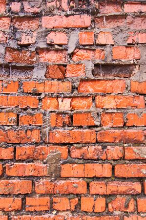 Old wet brick wall backgroundの写真素材