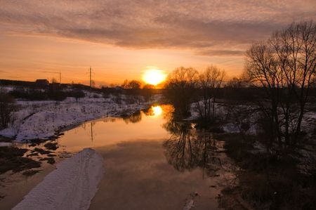Spring sunset on the riverの写真素材