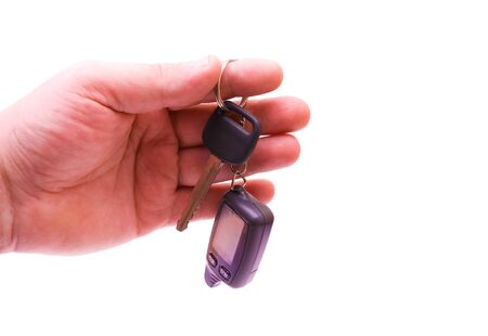 Key from the car in a hand of the manの写真素材