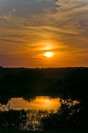 Colourful sunset against cloudsの写真素材