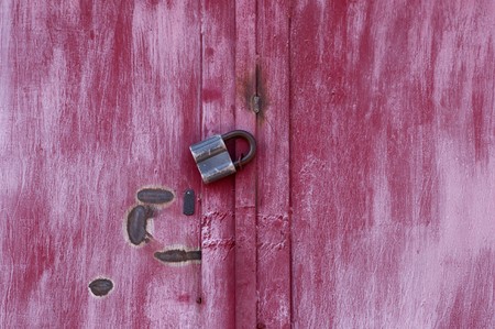Old padlock on garage collarsの写真素材