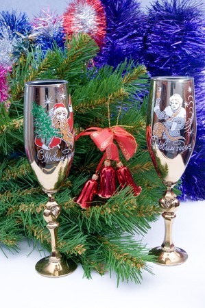 Two New Year's glasses near to a fur-treeの写真素材