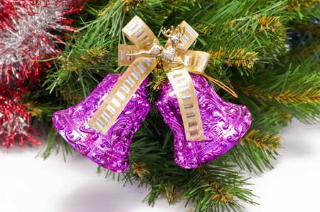 Hand bells on a Christmas New Year treeの写真素材