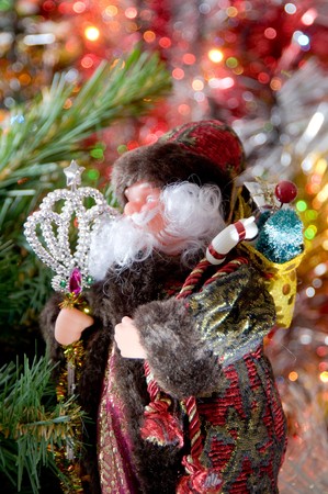 Santa Claus with gifts under a fur-treeの写真素材