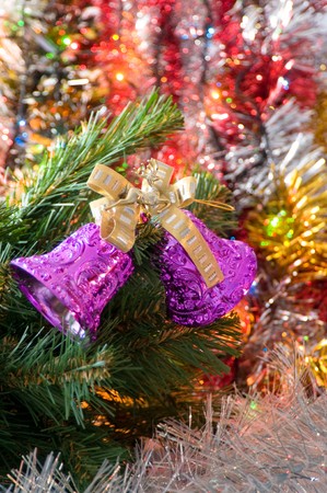 Hand bells on a Christmas New Year treeの写真素材