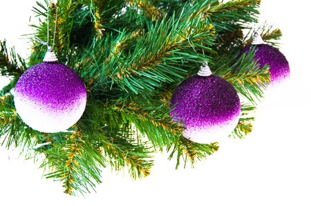 Three gold balls on a Christmas fur-treeの写真素材