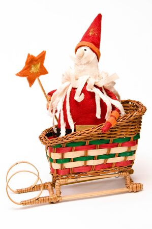 Santa Claus with gifts under a fur-treeの写真素材