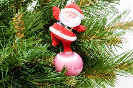 Santa Claus with gifts under a fur-treeの写真素材