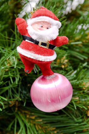 Santa Claus with gifts under a fur-treeの写真素材