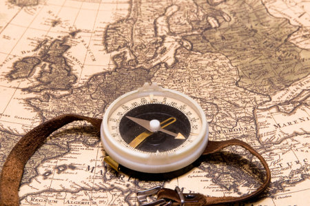 The compass lies on an old card