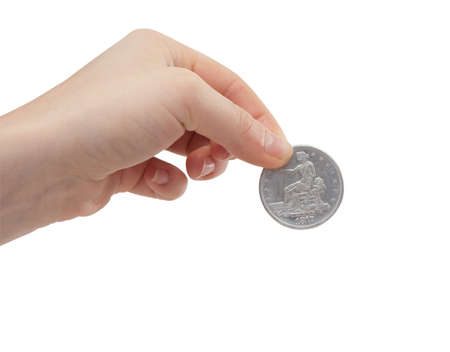 female hand holding a silver dollar coinの写真素材