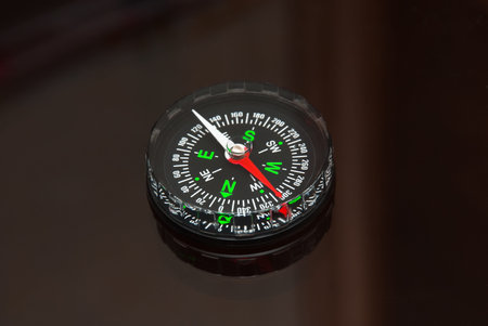 black modern compass on the glass