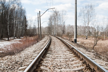 Railway rails leaving afar to horizonの写真素材