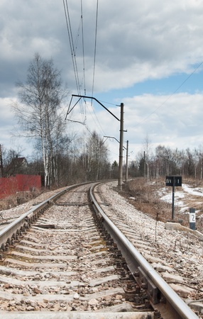Railway rails leaving afar to horizonの写真素材