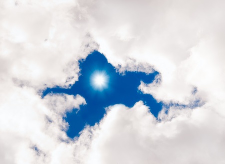 sun with clouds against the blue skyの写真素材