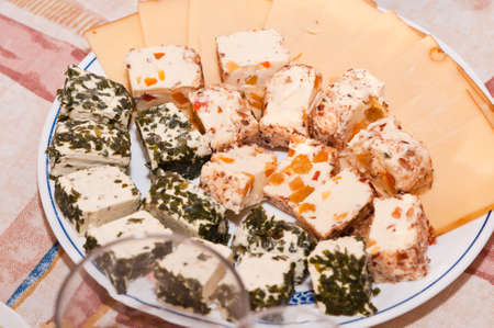 various pieces of cheese cut into a plateの写真素材