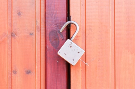 Old padlock on garage collarsの写真素材