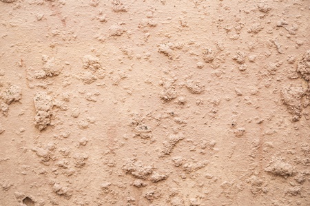 brown wall with cracked plaster timeの写真素材