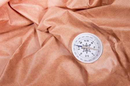 white compass lies against the skinの写真素材