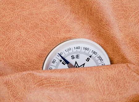 white compass lies against the skinの写真素材