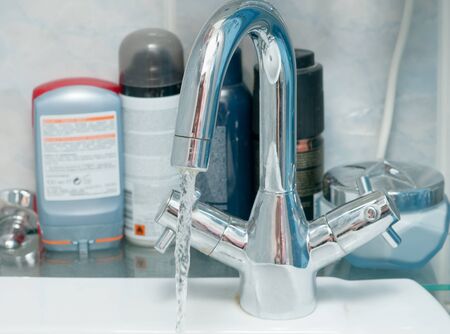 tap water in the bathroomの写真素材