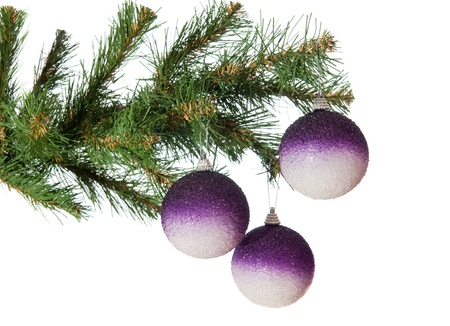 Three gold balls on a Christmas fur-treeの写真素材