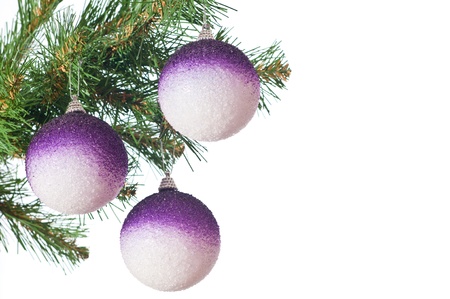 Three gold balls on a Christmas fur-treeの写真素材