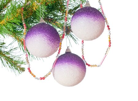 Three gold balls on a Christmas fur-treeの写真素材