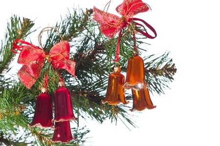 Hand bells on a Christmas New Year treeの写真素材