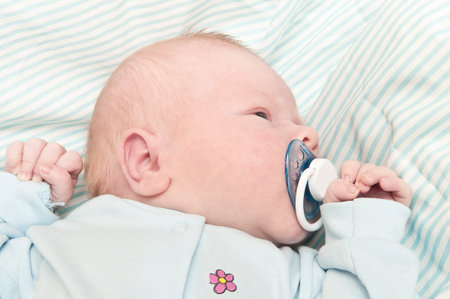 Newborn baby lying in a blanket