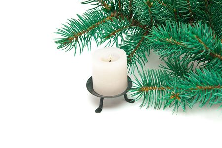 burning candle and spruce twigの写真素材