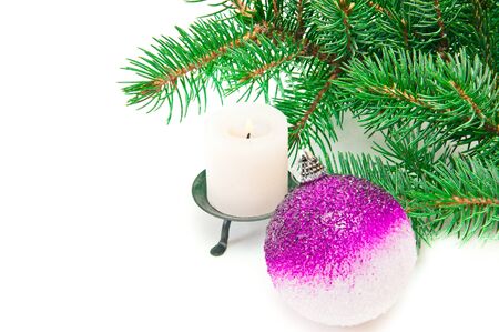 burning candle and spruce twigの写真素材