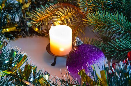 burning candle and spruce twigの写真素材