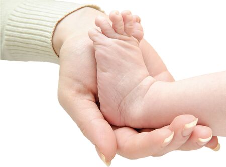 female hand holding the leg of an infantの写真素材