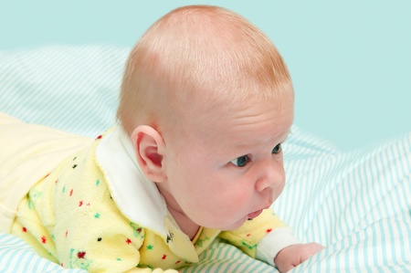 Newborn baby lying in a blanketの写真素材