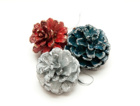 Christmas fir cones in different colorsの写真素材