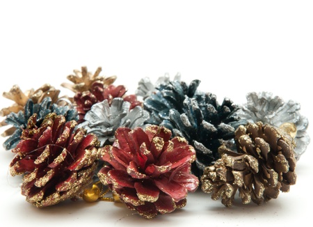 Christmas fir cones in different colorsの写真素材