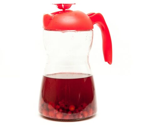 bottle with a sweet compote of fresh berriesの写真素材