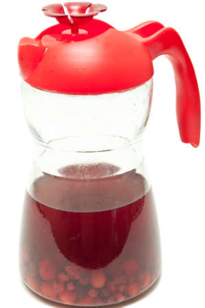 bottle with a sweet compote of fresh berriesの写真素材