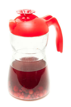 bottle with a sweet compote of fresh berriesの写真素材