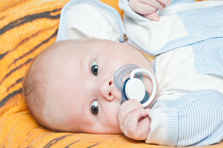 Newborn baby lying in a blanket