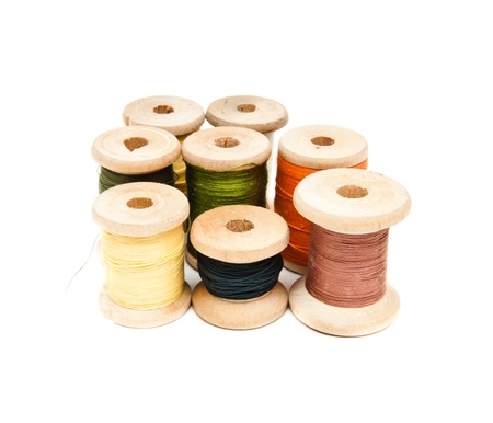 yarns of different colors wound on the coilの写真素材