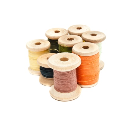 yarns of different colors wound on the coilの写真素材