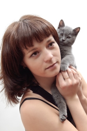 woman holding a gray kitten Britishの写真素材