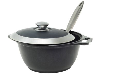 iron pan with a lid and spoonの写真素材
