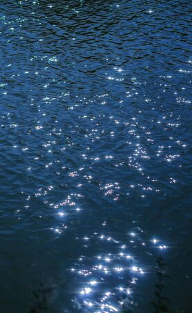 reflection of the sun on the water surfaceの写真素材