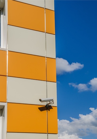 video surveillance camera at the corner of the buildingの写真素材