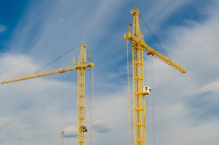 yellow crane in the skyの写真素材