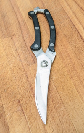 scissors for cutting fish on boardの写真素材